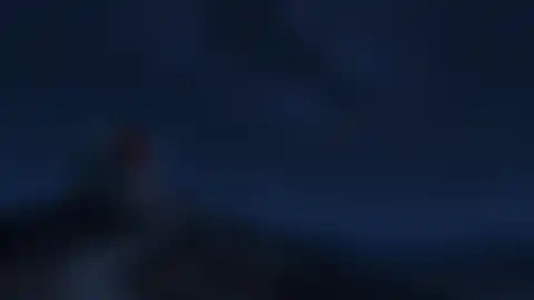 Blurred preview of an observatory beneath the night sky